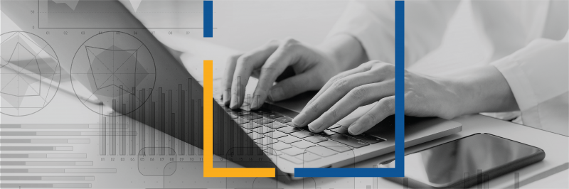 Focus shot of a set of hands typing on a laptop